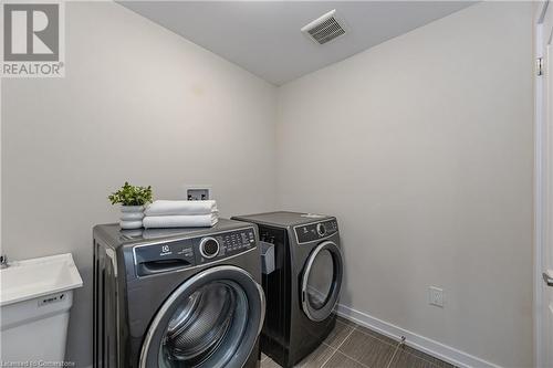 Clothes washing area featuring independent washer and dryer - 116 Whithorn Crescent, Caledonia, ON - Indoor Photo Showing Laundry Room