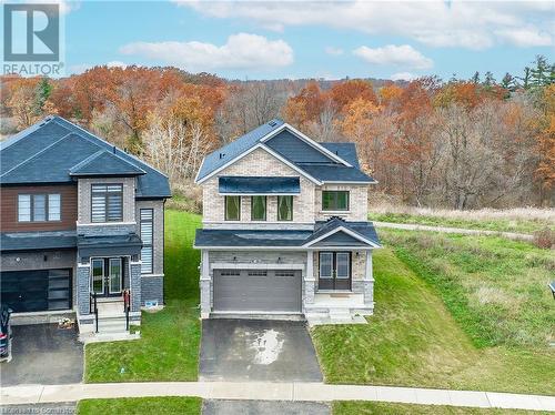 View of front facade featuring a front lawn and a garage - 116 Whithorn Crescent, Caledonia, ON - Outdoor With Facade