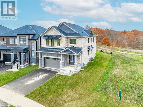 View of front of home with a front yard and a garage - 116 Whithorn Crescent, Caledonia, ON - Outdoor With Facade