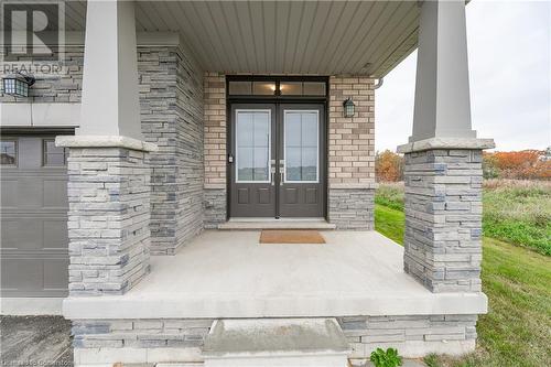 View of exterior entry with french doors and a porch - 116 Whithorn Crescent, Caledonia, ON - Outdoor