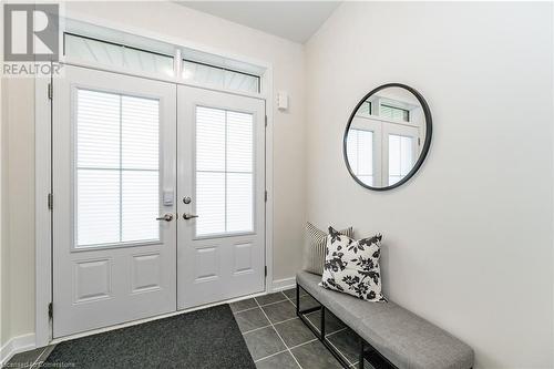 Doorway featuring dark tile patterned floors - 116 Whithorn Crescent, Caledonia, ON - Indoor Photo Showing Other Room