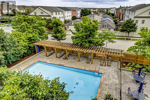 405 - 2365 Central Park Drive, Oakville, ON - Outdoor With In Ground Pool