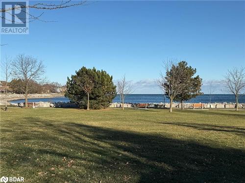 View of community with a yard and a water view - 2263 Marine Drive Unit# 607, Oakville, ON 