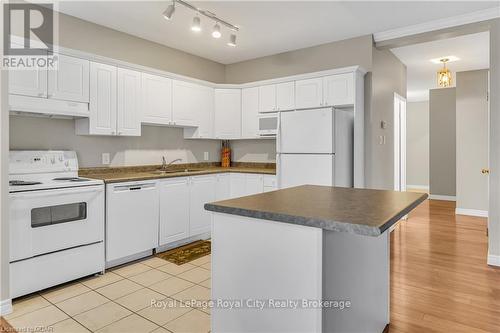 311 - 60 Wyndham Street S, Guelph (Two Rivers), ON - Indoor Photo Showing Kitchen With Double Sink