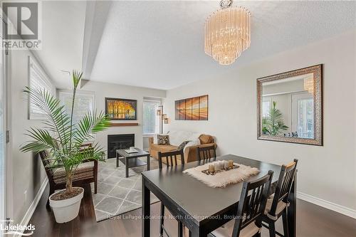 201 - 4 Brandy Lane Drive, Collingwood, ON - Indoor Photo Showing Dining Room With Fireplace