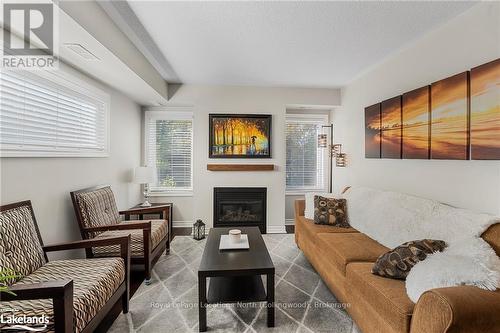 201 - 4 Brandy Lane Drive, Collingwood, ON - Indoor Photo Showing Living Room With Fireplace