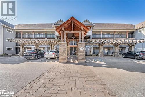 201 - 4 Brandy Lane Drive, Collingwood, ON - Outdoor With Balcony With Facade