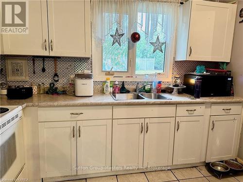 13 Coventry Crescent, Kingston (West Of Sir John A. Blvd), ON - Indoor Photo Showing Kitchen With Double Sink