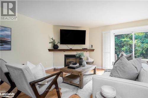 3 - 63 Bay Street W, Blue Mountains (Thornbury), ON - Indoor Photo Showing Living Room With Fireplace