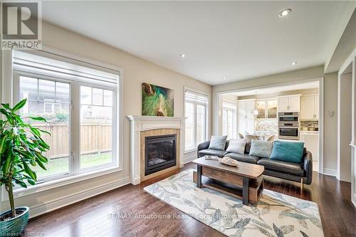 211 Sixteen Mile Drive, Oakville (1008 - Go Glenorchy), ON - Indoor Photo Showing Living Room With Fireplace