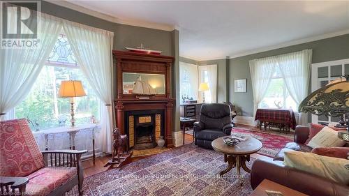 73399 London Road, Bluewater (Hay), ON - Indoor Photo Showing Living Room With Fireplace