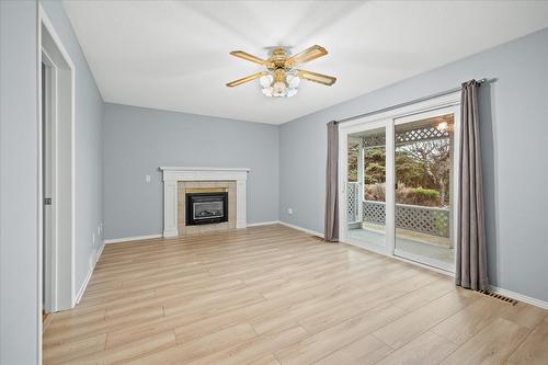 908 Vickers Court, Kelowna, BC - Indoor Photo Showing Living Room With Fireplace