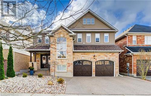 View of front of house with a garage - 32 Triller Avenue, Cambridge, ON - Outdoor With Facade