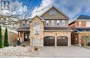 View of front of house with a garage - 32 Triller Avenue, Cambridge, ON  - Outdoor With Facade 