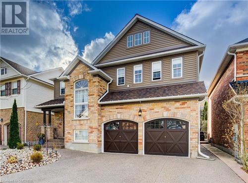 View of front of property featuring a garage - 32 Triller Avenue, Cambridge, ON - Outdoor