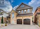 View of front of property featuring a garage - 32 Triller Avenue, Cambridge, ON  - Outdoor 