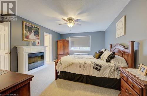 Bedroom featuring ceiling fan and light colored carpet - 32 Triller Avenue, Cambridge, ON - Indoor Photo Showing Bedroom