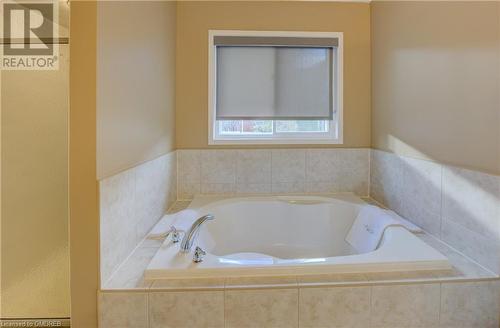 Bathroom featuring tiled bath - 32 Triller Avenue, Cambridge, ON - Indoor Photo Showing Bathroom