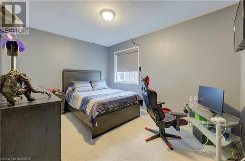 Bedroom with a textured ceiling and carpet floors - 32 Triller Avenue, Cambridge, ON - Indoor Photo Showing Bedroom