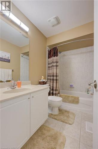 Full bathroom with shower / bath combination with curtain, vanity, tile patterned floors, and toilet - 32 Triller Avenue, Cambridge, ON - Indoor Photo Showing Bathroom