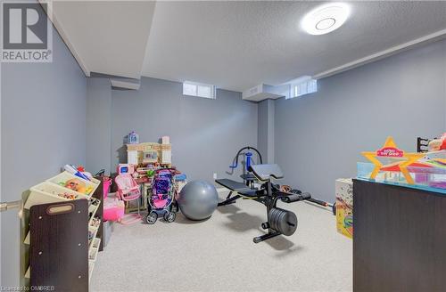 Game room with carpet and a textured ceiling - 32 Triller Avenue, Cambridge, ON - Indoor