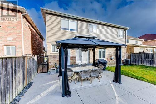 Back of property featuring a patio, a yard, and a gazebo - 32 Triller Avenue, Cambridge, ON - Outdoor