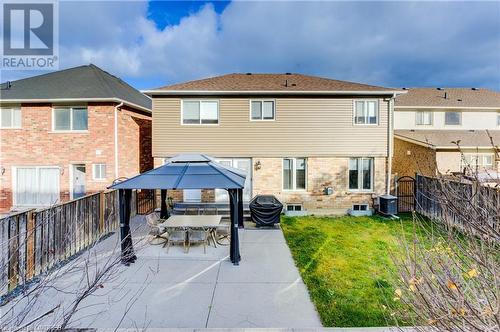 Rear view of property with central AC unit and a patio - 32 Triller Avenue, Cambridge, ON - Outdoor With Exterior