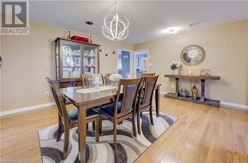 Dining space featuring an inviting chandelier and light hardwood / wood-style flooring - 32 Triller Avenue, Cambridge, ON - Indoor Photo Showing Dining Room