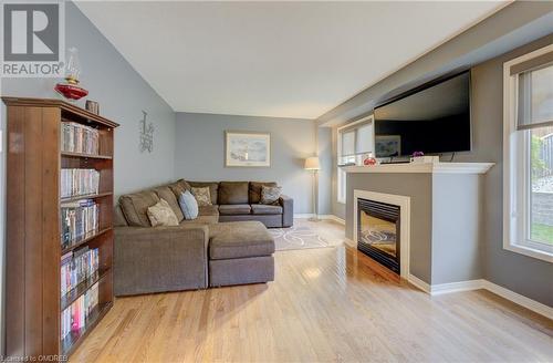 Living room with light hardwood / wood-style flooring - 32 Triller Avenue, Cambridge, ON - Indoor Photo Showing Living Room With Fireplace