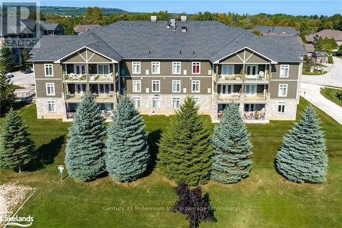 201 - 27 Beaver Street S, Blue Mountains (Thornbury), ON - Outdoor With Balcony With Facade