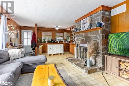 165 James Camp Road, Ryerson, ON - Indoor Photo Showing Living Room With Fireplace