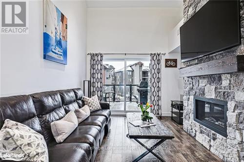 304 - 10 Beausoleil Lane, Blue Mountains (Blue Mountain Resort Area), ON - Indoor Photo Showing Living Room With Fireplace