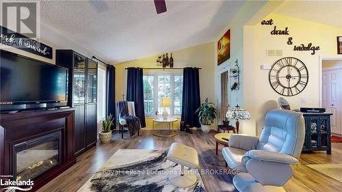 69 St James Place, Wasaga Beach, ON - Indoor Photo Showing Living Room With Fireplace