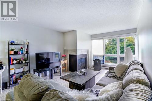 402 - 5 Jacksway Crescent, London, ON - Indoor Photo Showing Living Room With Fireplace