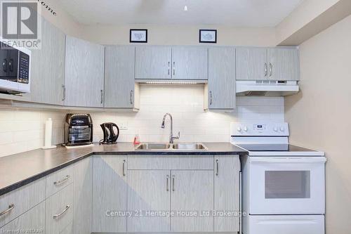 112 - 163 Ferguson Drive, Woodstock (Woodstock - South), ON - Indoor Photo Showing Kitchen With Double Sink