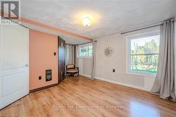 Spare room featuring heating unit and light wood-type flooring - 