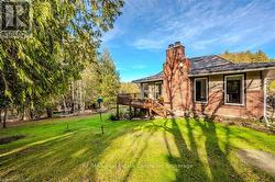 View of yard featuring a deck - 