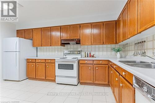 202 - 2175 Marine Drive, Oakville (1001 - Br Bronte), ON - Indoor Photo Showing Kitchen With Double Sink