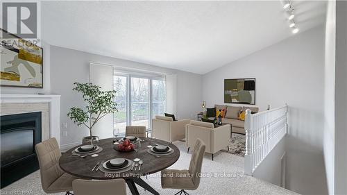 15 - 90 Ontario Street S, Lambton Shores, ON - Indoor Photo Showing Dining Room With Fireplace