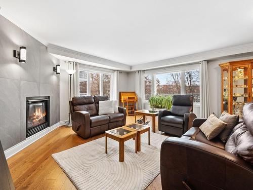 Living room - 1131 Rue Du Sous-Bois, Longueuil (Le Vieux-Longueuil), QC - Indoor Photo Showing Living Room With Fireplace