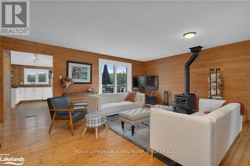 1433 South Horn Lake Road, Ryerson, ON - Indoor Photo Showing Living Room With Fireplace