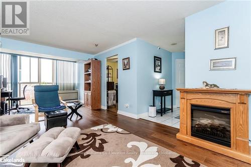 614 - 41 Markbrook Lane, Toronto (Mount Olive-Silverstone-Jamestown), ON - Indoor Photo Showing Living Room With Fireplace