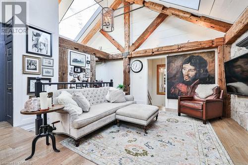 Living room with hardwood / wood-style floors, beamed ceiling, high vaulted ceiling, and a chandelier - 1486 Kenmuir Avenue, Mississauga, ON - Indoor Photo Showing Living Room