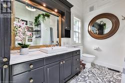 Bathroom with tile patterned flooring, vanity, and toilet - 