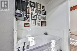 Bathroom featuring hardwood / wood-style floors and a bathtub - 