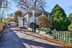 View of front of property with a garage and an outbuilding - 