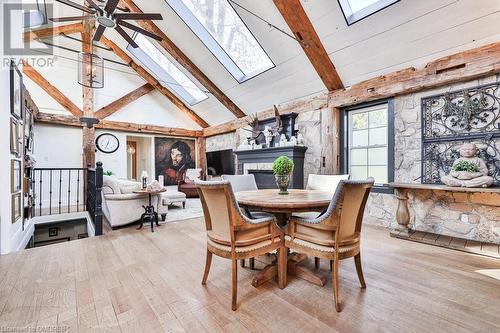 Dining room featuring a skylight, ceiling fan, high vaulted ceiling, light hardwood / wood-style flooring, and beamed ceiling - 1486 Kenmuir Avenue, Mississauga, ON - Indoor