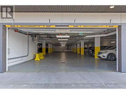 Secured parking garage. Unit comes with 1 stall - 191 Hollywood Rd S Road Unit# 320, Kelowna, BC - Indoor Photo Showing Garage