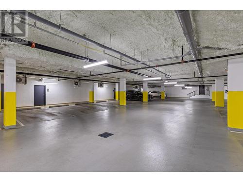 Secured parking garage. Unit comes with 1 stall - 191 Hollywood Rd S Road Unit# 320, Kelowna, BC - Indoor Photo Showing Garage