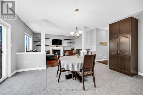 31 Showcase Drive, Hamilton, ON - Indoor Photo Showing Dining Room With Fireplace